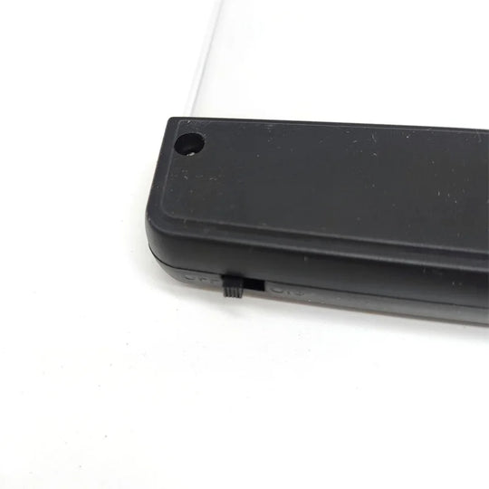 Ultra-slim LED page reading light illuminating an open book, portable acrylic book lamp for night reading.
black piece of led screen with switch "off" and "on" 
