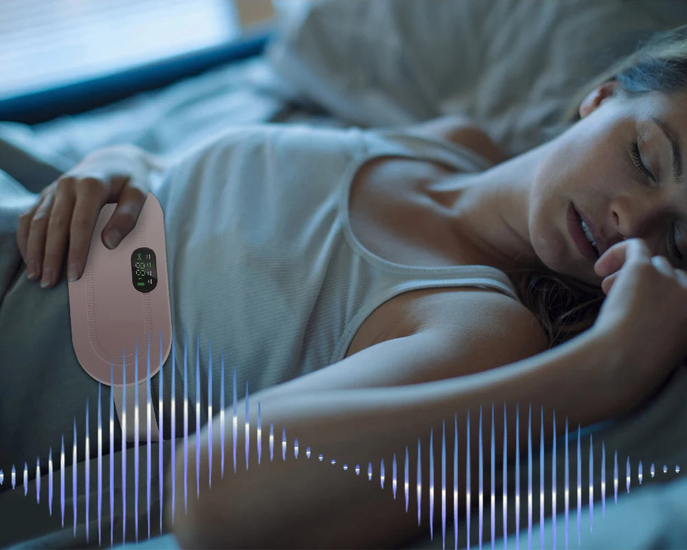 Woman sleeping peacefully with an electric heating waist belt on her abdomen, showcasing comfortable pain relief with soothing vibration and warmth.